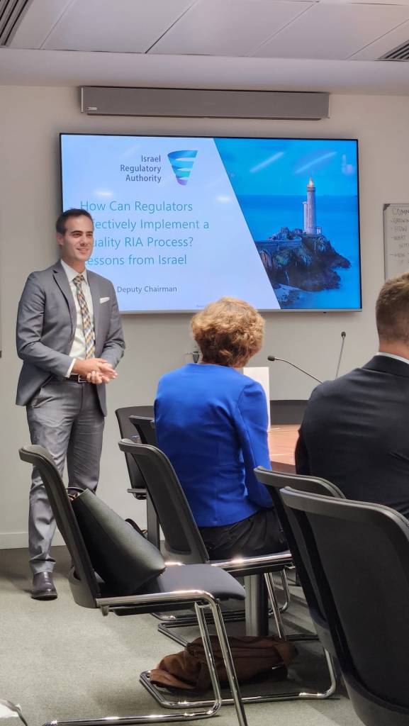 Guy Mor speaking at an OECD conference panel on regulatory policy and governance