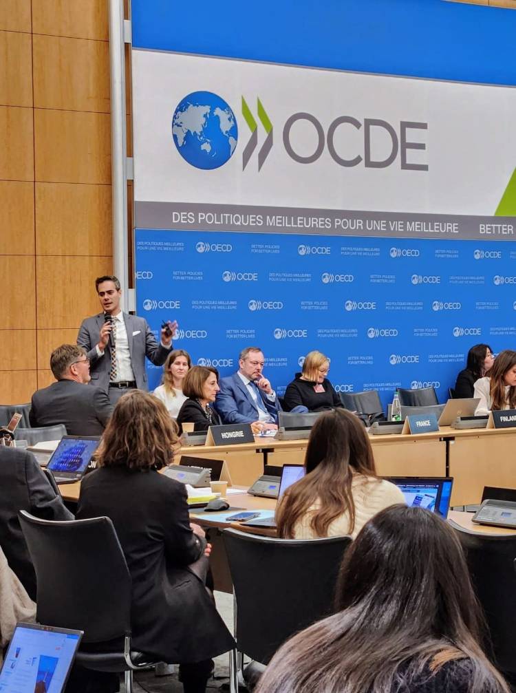 Guy Mor speaking at an OECD policy panel, presenting regulatory insights to international public policy professionals