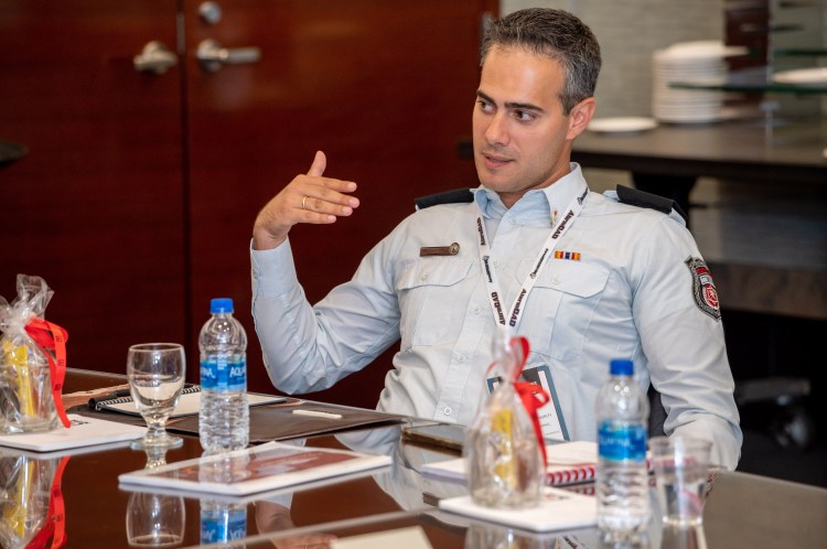 Guy Mor, public policy officer, explaining risk management strategies in a professional setting